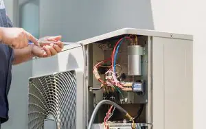 Service technician working on ac system