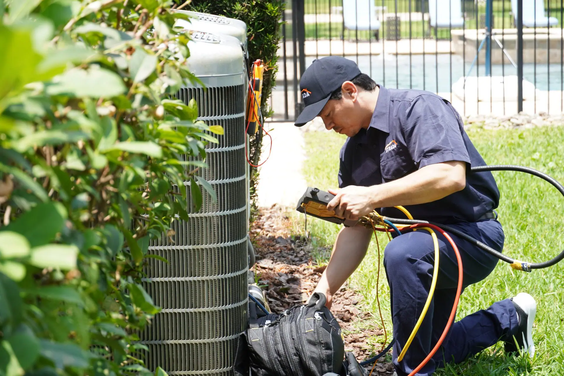 Strada Service Technician working on Carrier HVAC system