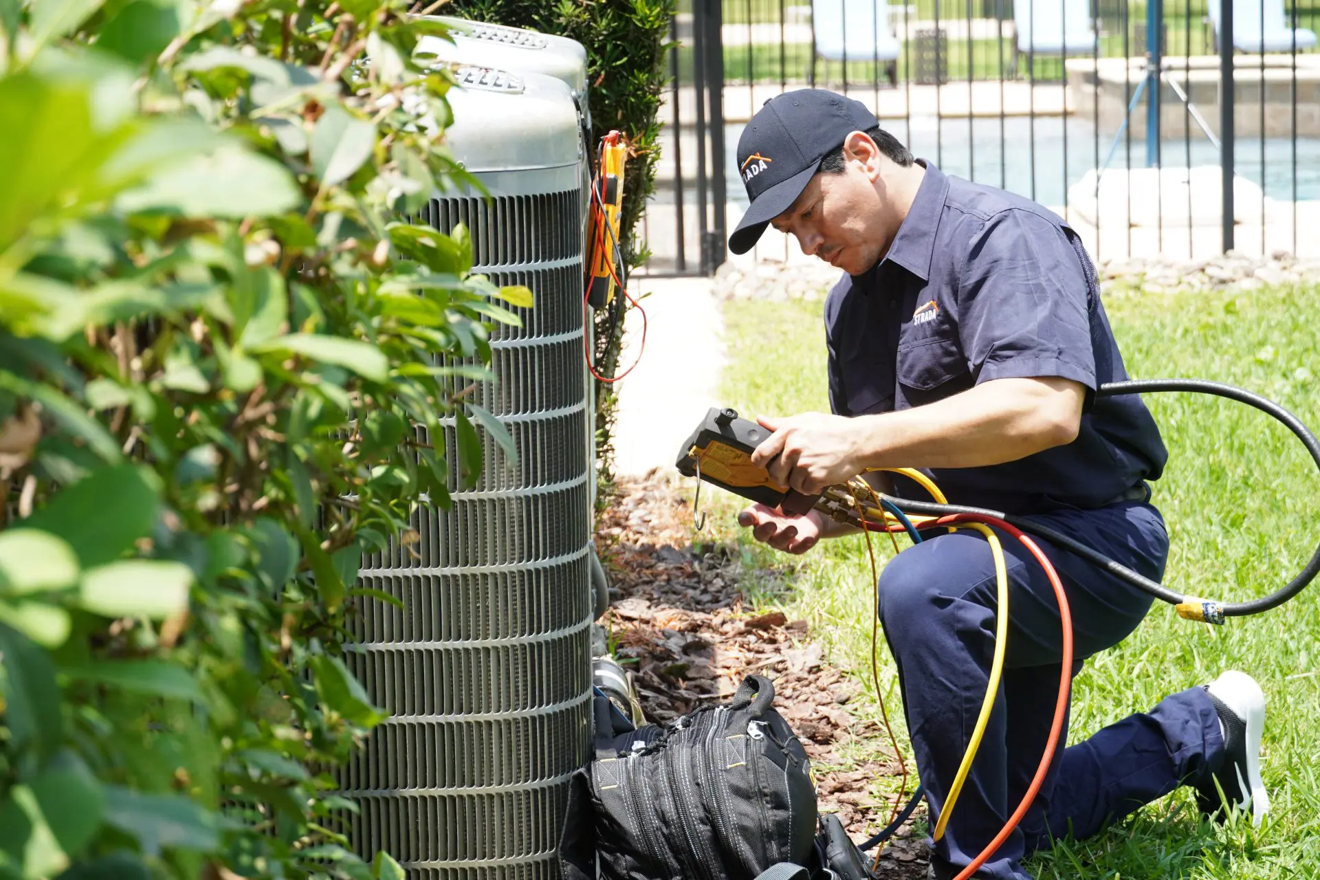 Strada Service Technician working on HVAC system repair
