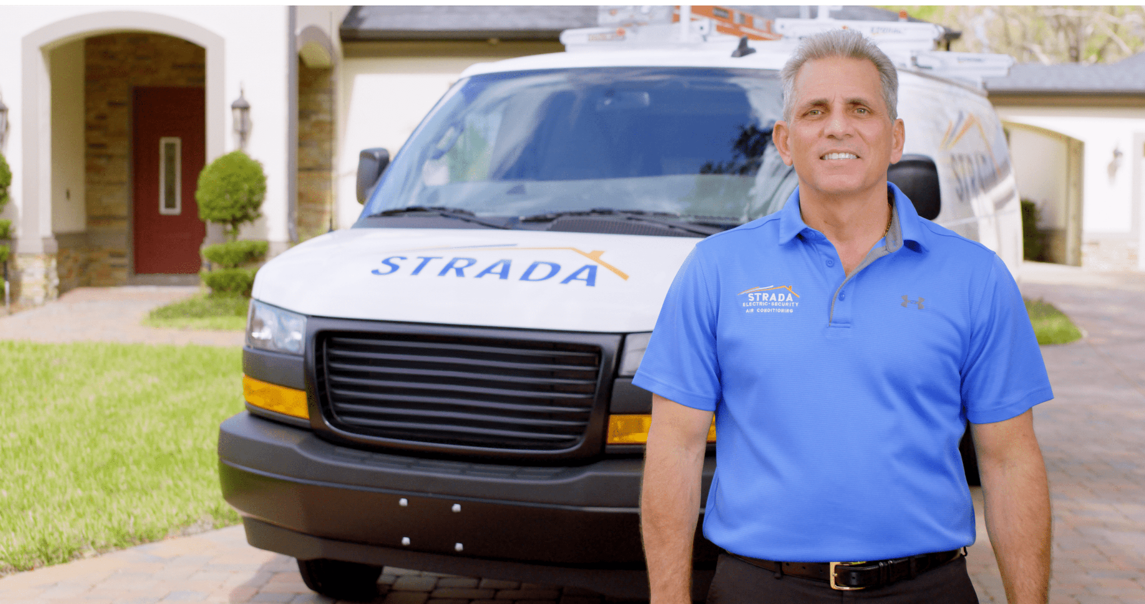 CEO Joe Strada standing in front of Strada Service truck