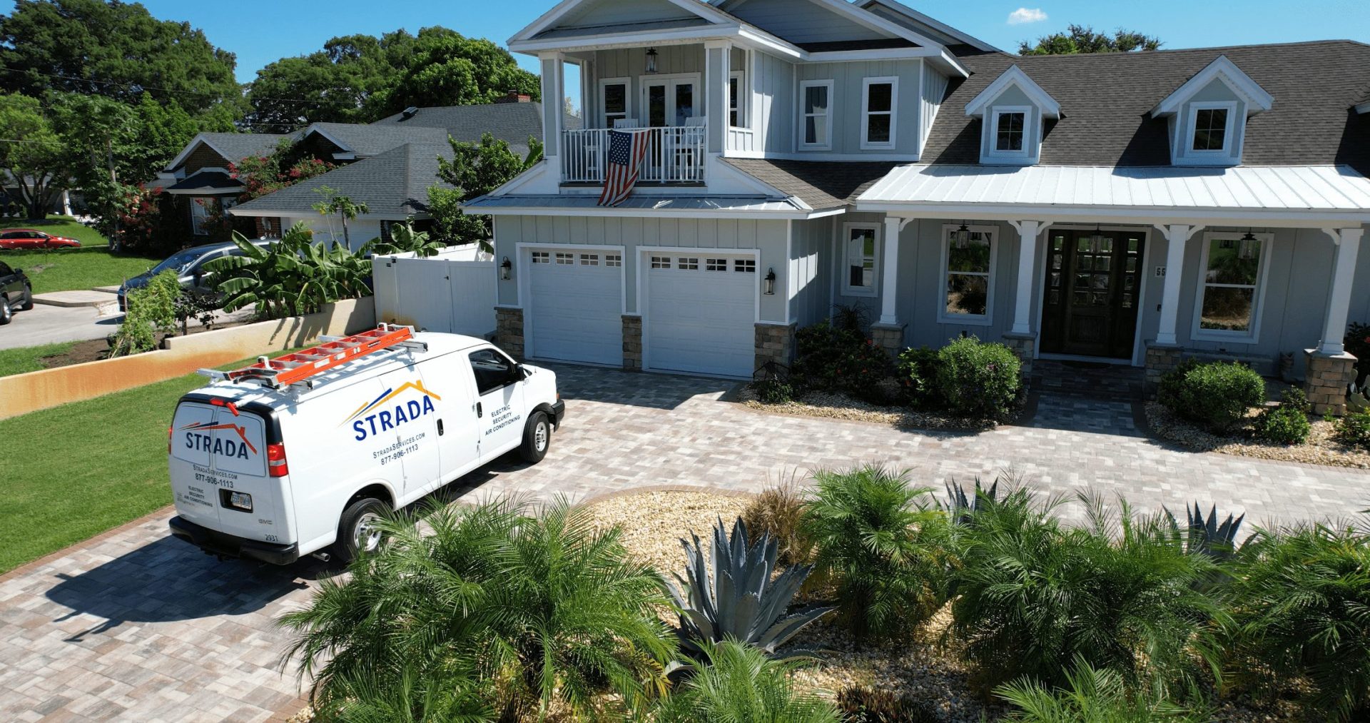 Strada Services truck parked outside residential home