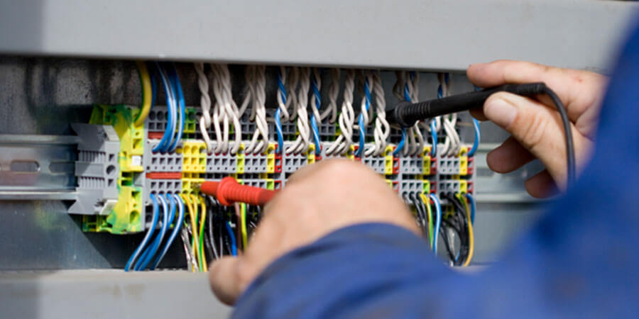 Technician completing electrical services