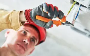 Service technician completing an electrical repair