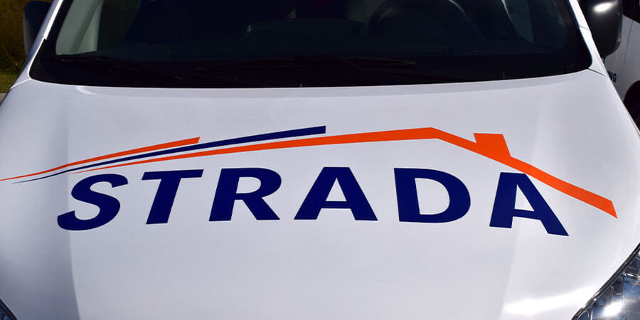 Strada logo on front of Strada Services van