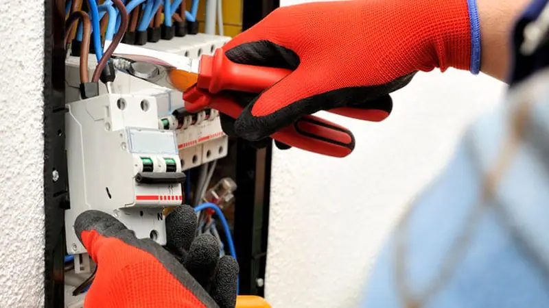 Technician working on electrical system